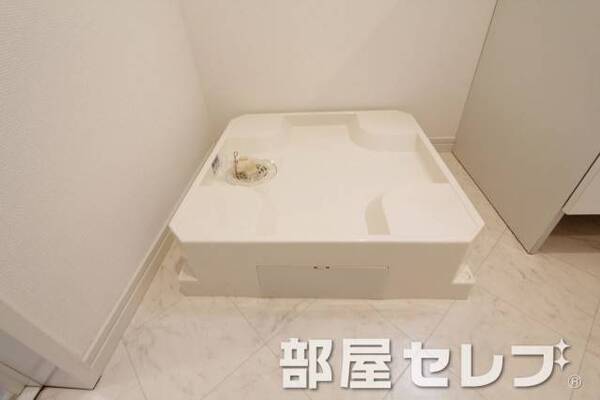 洗濯機置場はこちらへ。
